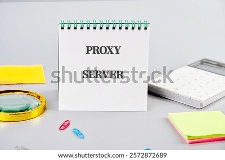 A notepad displays the term proxy server alongside office supplies, highlighting its significance in technology for business uses today.