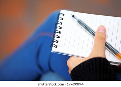 Notepad hold by hand