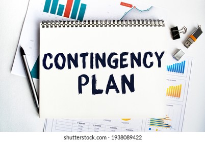 Notepad with the inscription CONTINGENCY PLAN. Conceptual image, business accessories, calculator isolated on the desktop. Finance or business concept. - Shutterstock ID 1938089422