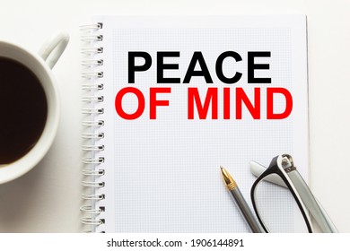 Notepad With Inscriptions PEACE OF MIND On A White Background. Business Concept.