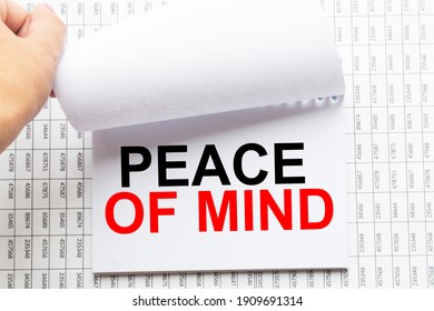 Notepad With Inscriptions PEACE OF MIND On A White Background. Business Concept.