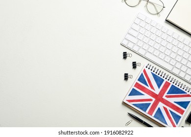 Notepad, Keyboard And Stationery On White Background, Flat Lay With Space For Text. Learning English