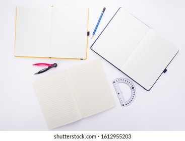 notepad or notebook paper at white background, top view - Powered by Shutterstock