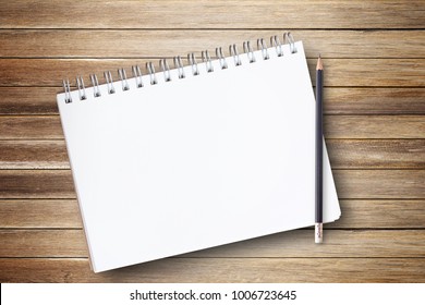 Notepad Or Notebook With Pencil On Brown Wood Table Background.using Wallpaper For Education, Business Photo.Take Note Of The Product For Book With Paper And Concept, Object Or Copy Space.