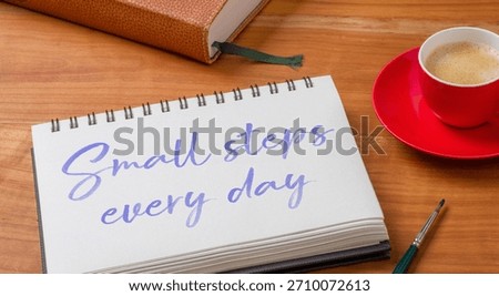  Notepad on a desk - Small steps every day