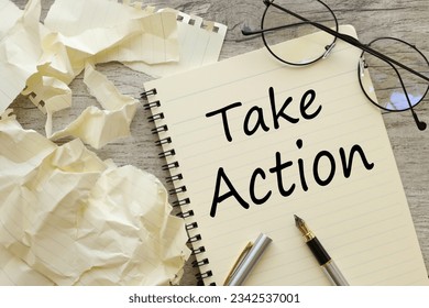 notepad on the desktop. text Take action
