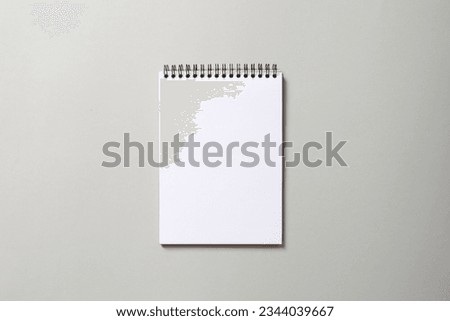 notepad on gray background, space for text