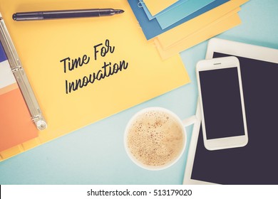 Notepad on workplace table and written TIME FOR INNOVATION concept
