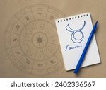 Notepad with pen and drawing of zodiac sign Taurus