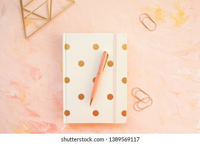 Notepad and pen on a desk workspace, pink backround. Flat lay, top view, social media hero header template, lifestyle concept. - Powered by Shutterstock