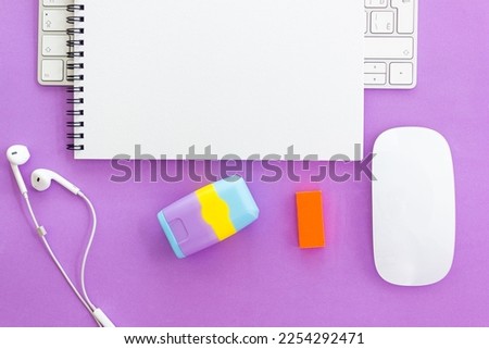 Notepad with pen and sharpener on computer desk