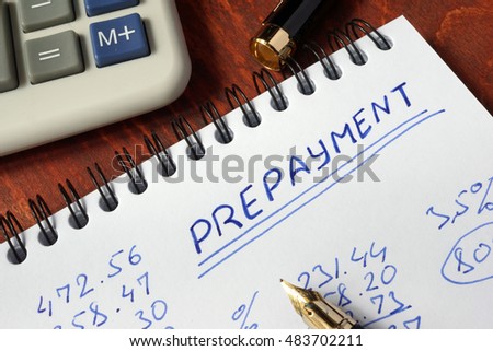 Notepad with prepayment on a wooden surface.