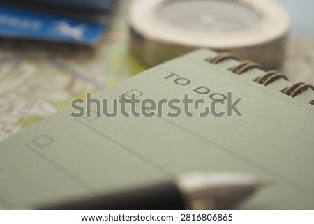 Notepad shows a to-do list with an empty checklist and a compass.
