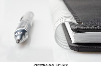 Notepad with silver pencil