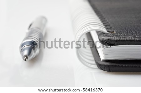 Notepad with silver pencil