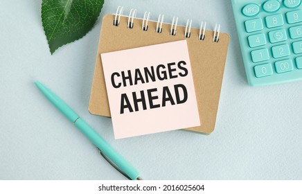 Notepad with text Changes Ahead. Diagram and white background