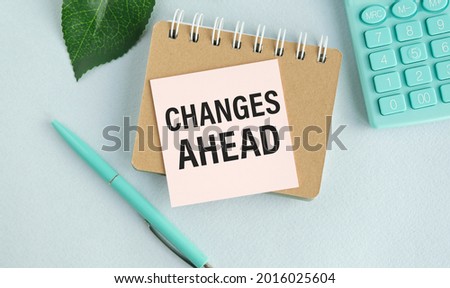 Notepad with text Changes Ahead. Diagram and white background