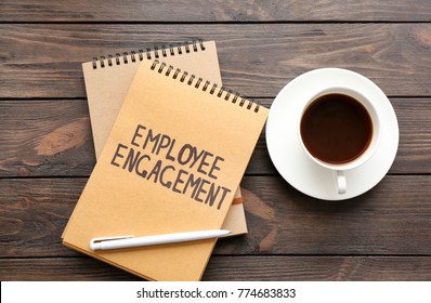 Notepad With Text EMPLOYEE ENGAGEMENT And Coffee On Table