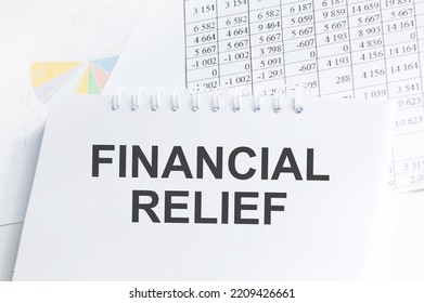 A Notepad With Text Financial Relief On The White Background