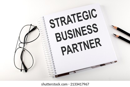 Notepad With Text STRATEGIC BUSINESS PARTNER . White Background. Business