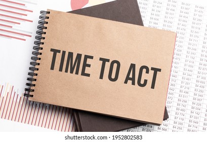 Notepad with text Time To Act on a charts and numbers. Business concept.