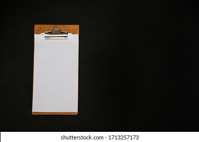 Notepad With White Blank Space For Daily Tasks Or Recipes On A Black Background