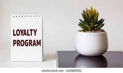 Notepad With Word Loyalty Program On White Background