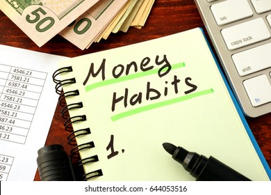 Notepad with word Money Habits. Saving and planning concept.