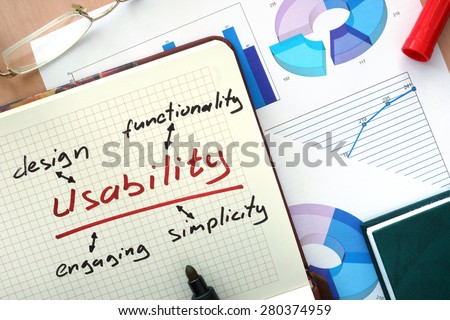 Notepad with word usability concept and marker.