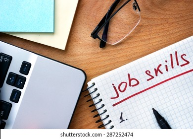 Notepad With Words Job Skills On A Wooden Background