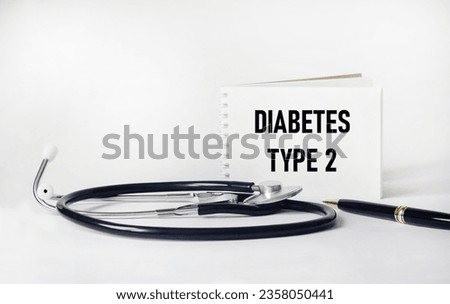Notepad with words Type 2 Diabetes and stethoscope and pen.