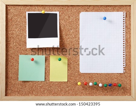 Notes paper and photo card on wooden background