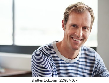 Nothing Beats A Can-do Attitude. Portrait Of Smiling Man Sitting In A Casual Work Environment.