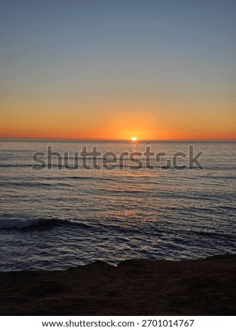 Nothing beats the magic of a beach sunset to end the day. The sun saying goodbye, painting the sky with fire, while the silhouettes watch in peace. This is what I call a perfect moment.