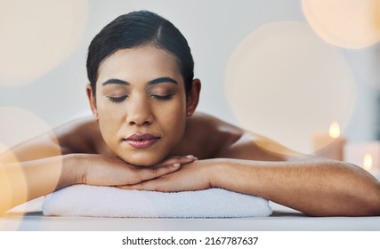 Nothing Can Spoil Her Mood. Shot Of A Relaxed An Cheerful Young Woman Getting A Massage Indoors At A Spa.