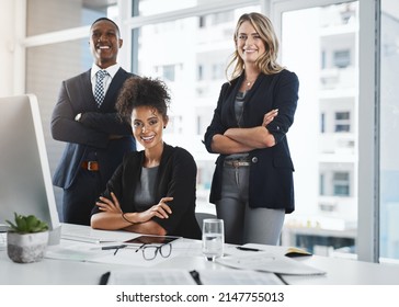 Nothing Does It As Well As Teamwork. Portrait Of A Group Of Businesspeople Working Together In An Office.