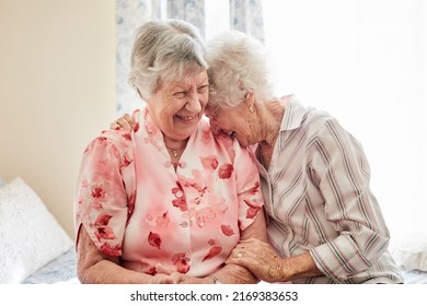 Nothing inspires happiness like a good old friend. Shot of two happy elderly women embracing each other at home. - Powered by Shutterstock