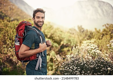 Nothing Like A Good Hike To Make You Feel Alive. Shot Of A Young Man Enjoying A Hike Through The Mountains.