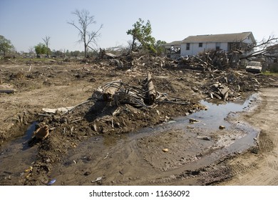 Nothing But A Pile Of Rubble Remains Of The Houses That Once Occupied Lots In The Ninth Ward Of New Orleans. Construction Continues On The Levy Broken By The Flood Waters Of Katrina.