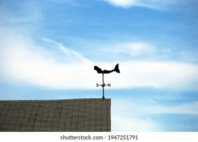 Notical Mermaid Weathervane On A Sunny Seacoast Home Rooftop Pointing Wind From The South