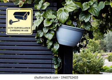 Notice CCTV Surveillance Cameras In Use Plastic Sign with icon. Warning to ward off potential intruders and criminals. Security and safety concept.