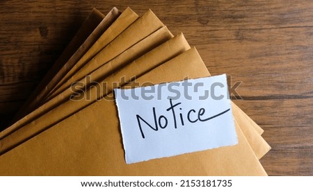 Notice message concept written post it on envelopes.