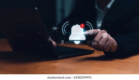 Notification bell alert of application from business communication connectivity concept for digital with email and marketing notifications. Businessman using laptop internet technology. - Powered by Shutterstock