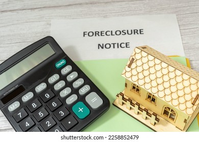 Notification of seizure of a house. Calculator and house. Lack of payment to financial institution. Real estate crisis - Shutterstock ID 2258852479