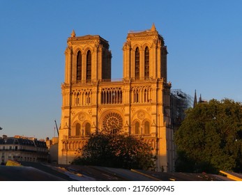 Notre Dame De Paris Cathedral In Front Of The Sunset