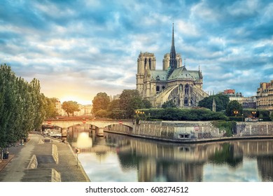 Notre Dame De Paris Cathedral Reflecting In River On Sunrise, Paris, France