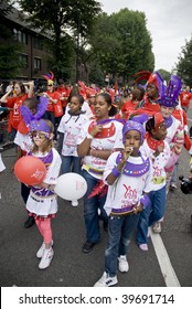 NOTTING HILL, LONDON - AUG 30: Children Taking Part In The Parade At The Notting Hill Carnival On August 30, 2009 In London, UK.