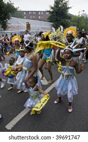 NOTTING HILL, LONDON - AUG 30: Children From The NUSTART Genasis Carnival Float At The Notting Hill Carnival On August 30, 2009 In London, UK.