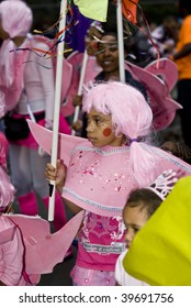 NOTTING HILL, LONDON - AUG 30: Children dresses in pink on the parade at the Notting Hill carnival on August 30, 2009 in London, UK.