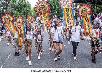 NOTTING HILL, LONDON, ENGLAND- 28 August 2022: Children In Costumes On The First Day Of Notting Hill Carnival 2022